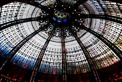 Low angle view of glass ceiling in shopping mall