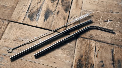 High angle view of piano keys on wooden table