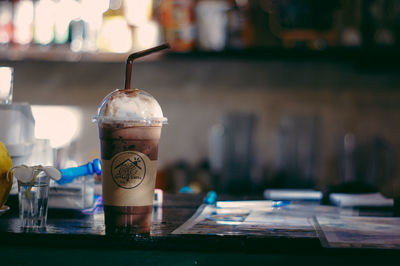 Close-up of coffee served on table at cafe