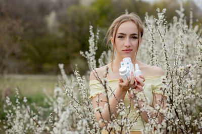 Portrait of a beautiful young woman on field