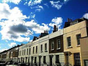 Low angle view of building against blue sky