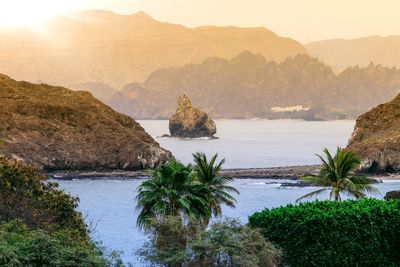 Scenic view of sea against mountains