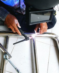 Close-up of man welding metal