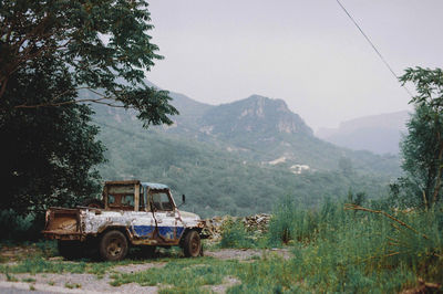 Tractor on field against sky