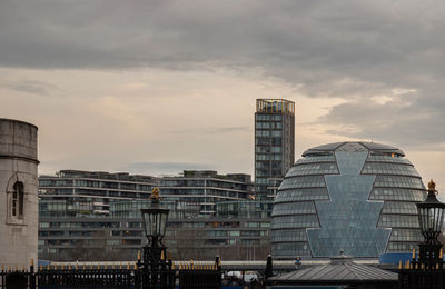 Low angle view of skyscrapers against sky during sunset