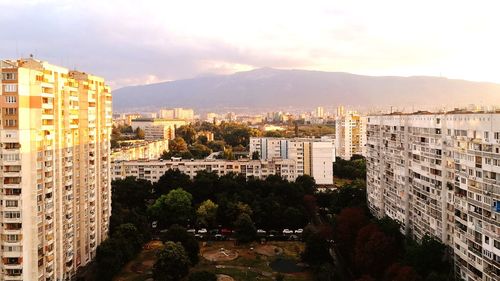 High angle view of buildings in city against sky