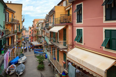 View of a manarola road. small motor boats, in winter, are paved in the street, under the houses. 