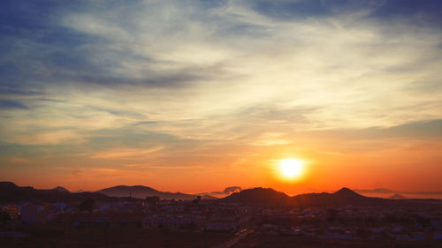 Scenic view of mountains at sunset