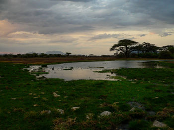 Scenic view of lake against sky during sunset