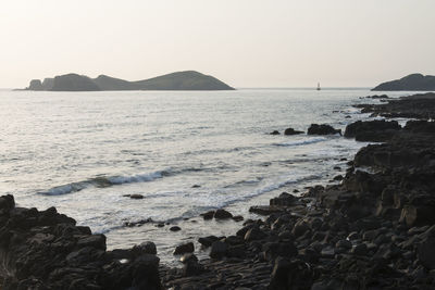 Scenic view of sea against clear sky