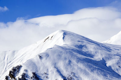 Snowy mountains landscape in gudauri, georgia. sunny day.