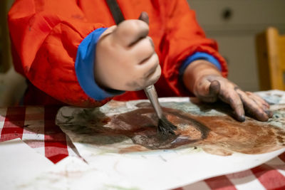 Close-up of man preparing food