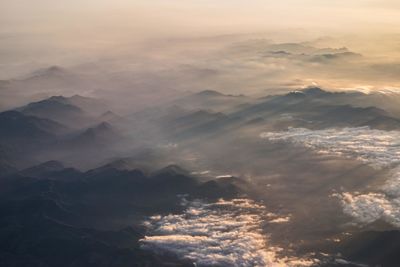 Aerial view of landscape during sunrise