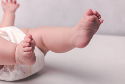 Low section of baby feet