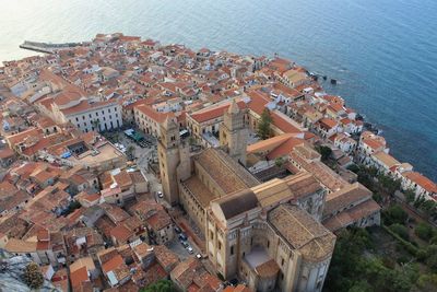 High angle view of townscape by sea