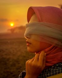 Close-up of beautiful woman standing outdoor