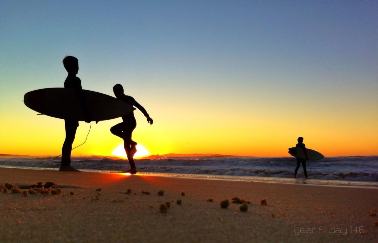 SILHOUETTE PEOPLE ON BEACH