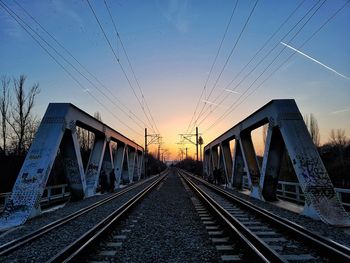 View of bridge in city at sunset