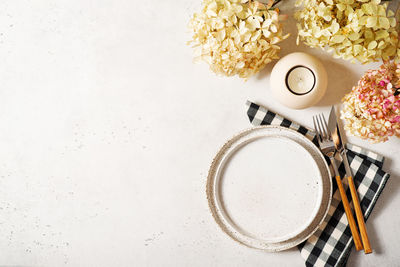 High angle view of coffee on table against white background