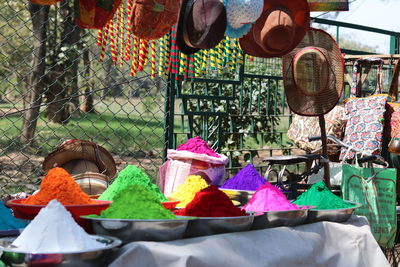 Multi colored umbrellas for sale at market stall