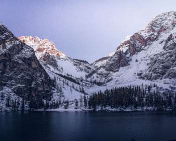 Scenic view of snowcapped mountains and lake against sky