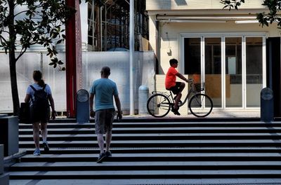 People walking on street in city