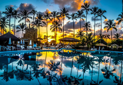 View of swimming pool at sunset