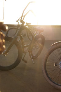 Close-up of bicycle parked against wall