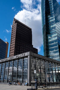 Low angle view of modern buildings against sky in city