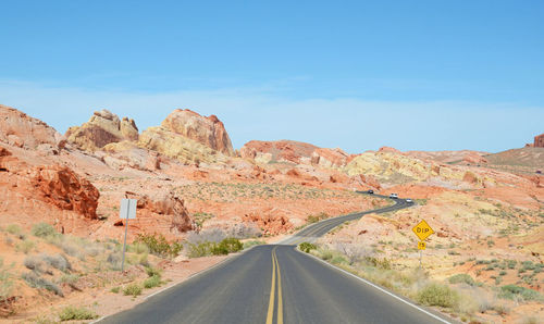 Country road leading towards mountains