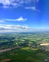 Aerial view of agricultural landscape against sky