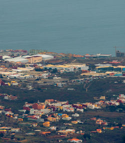 High angle view of buildings in city against sky