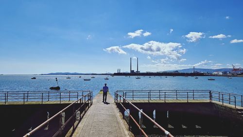 Pier over sea against sky