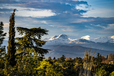 Scenic view of snowcapped mountains against sky