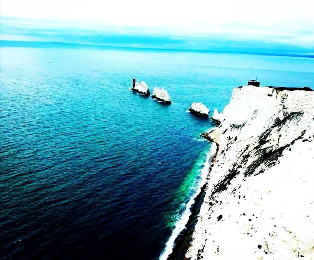 water, sea, scenics - nature, beauty in nature, nature, ocean, tranquility, nautical vessel, tranquil scene, sky, day, beach, no people, horizon over water, land, horizon, transportation, coast, ship, high angle view, blue, outdoors, idyllic, mode of transportation, bay, terrain, travel, auto post production filter, rock, shore, non-urban scene, turquoise colored, travel destinations, wave, islet