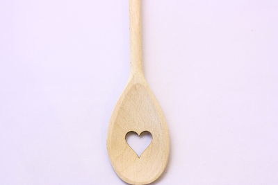 Close-up of heart shape over white background