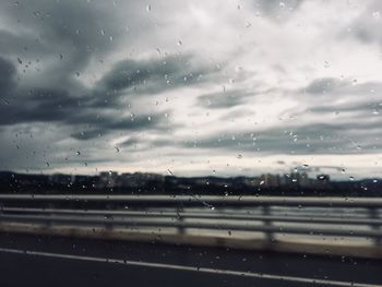 Raindrops on glass window of rainy season