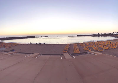 Scenic view of beach against sky during sunset