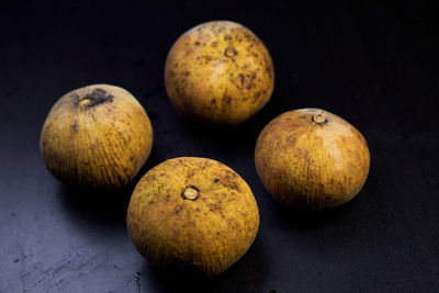 Close-up ripe santol fruit isolated on black background