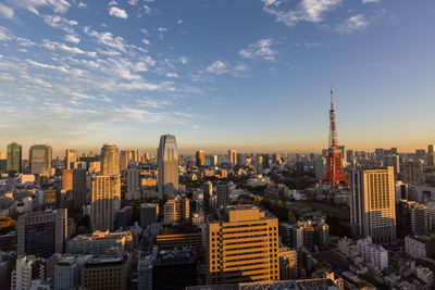 High angle view of city against cloudy sky