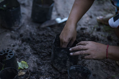 Low section of person working in mud