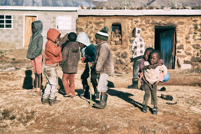 Rear view of people in traditional clothing