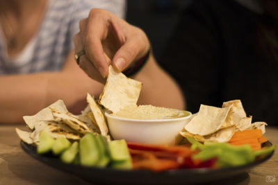 Close-up of preparing food on table