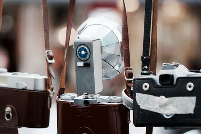 Old retro styled cameras hanging outdoors