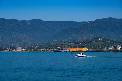 Scenic view of sea against clear blue sky