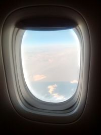 Airplane wing seen through window