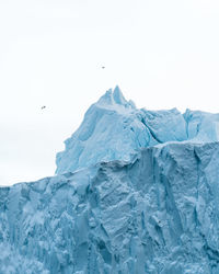 Scenic view of snowcapped landscape against clear sky