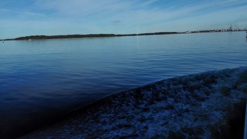 Scenic view of sea against blue sky