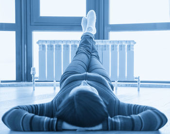 Low section of woman sitting on seat