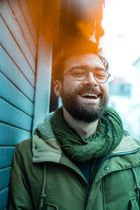 Portrait of smiling man in snow